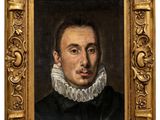 portrait of a man in a black dress with a white ruffled collar