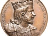 an image of a close up of a medal with a crown on it