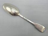 an antique silver spoon with the word love on it sitting on top of a table