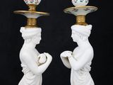 two white vases with gold trimmings on each of them