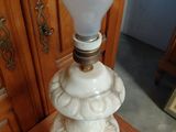 a lamp that is sitting on top of a wooden table