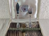 a box with silverware in it on a table