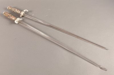 two metal needles that have been placed on a table