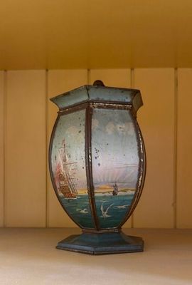a vase that is sitting on a shelf in a room