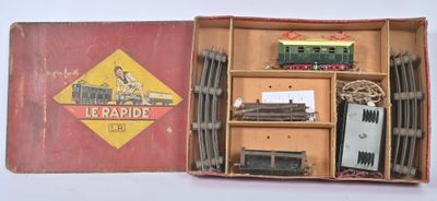 a small box with a train set inside of it