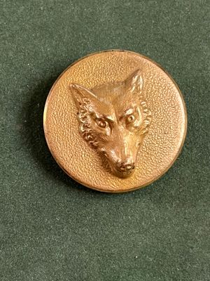 une image représentant une pièce d'or sur laquelle figure une tête de loup