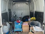 a white van with many items in the back of it
