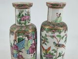 pair of chinese vases with birds and flowers on them