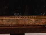 a mirror sitting on top of a wooden table