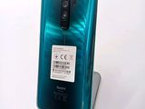 the back of a green phone with a price tag on it