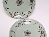 two plates that have flowers on them on them