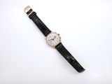 an image of a wrist watch on a white surface