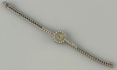 OMEGA MONTRE de dame en or gris 18K (750 millièmes) à boitie…