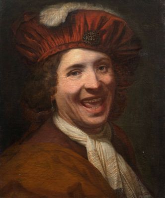 portrait of a laughing man in a red hat