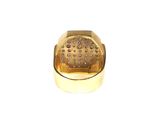 a gold ring with small holes in the middle