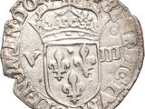 an old silver coin with a crown on top of it