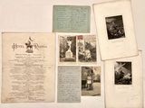 a lot of old letters and pictures on the table