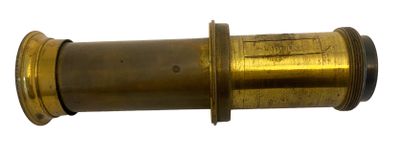 a close up of a brass colored telescope lens on a white background