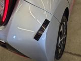 a close up of a car ' s bumper with a sticker on it