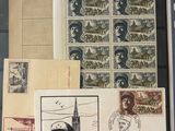 some old stamps and stamps are on display in a glass case