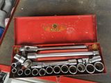 a red tool box with a set of tools inside of it