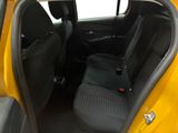 the back seats of a yellow car with a black seat belt