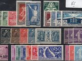 several different types of postage stamps are displayed on a black surface