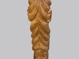 a close up of a wooden sculpture of a woman ' s head