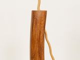 a tall wooden vase with a curved handle on a white background