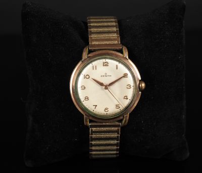 an image of a close up of a wrist watch on a pillow