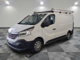 the white van is parked on a checkered floor in a room