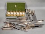a lot of knives that are sitting on a table