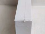 a close up of a piece of white paper on a table