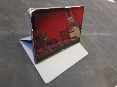 a laptop computer sitting on top of a table