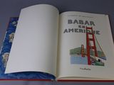 an open book with a picture of a bridge on it