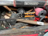 a pile of tools in the back of a truck