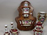 many different types of vases and cups on the table