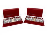 a pair of wine glasses in a red gift box
