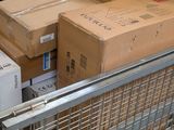 many boxes in a shopping cart on the street