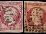 un ensemble de quatre timbres de couleurs différentes sur fond noir