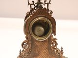 a small clock that is sitting on a table
