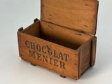 a small wooden box with chocolate menner written on it
