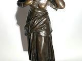statue of a woman talking on a cell phone on a white background