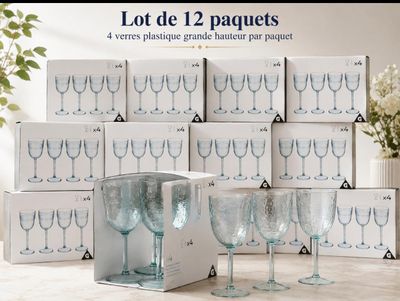 a lot of wine glasses that are sitting on a table