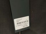 the back of a pair of pants with a tag on it