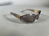 sunglasses on a table with a white table cloth and a white background