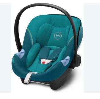 a close up of a baby car seat with a handlebar