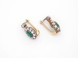 a pair of emerald and diamond earrings