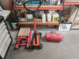 a picture of a garage with tools on the floor