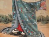 painting of a woman in a blue kimono with a fan